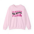 Light Pink In October We Wear Pink retro sweatshirt with groovy lettering, front view