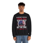 Model wearing the We Don't Know Them All But We Owe Them All Sweatshirt