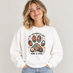 Model wearing the white All You Need Is Love And A Dog Sweatshirt with jeans