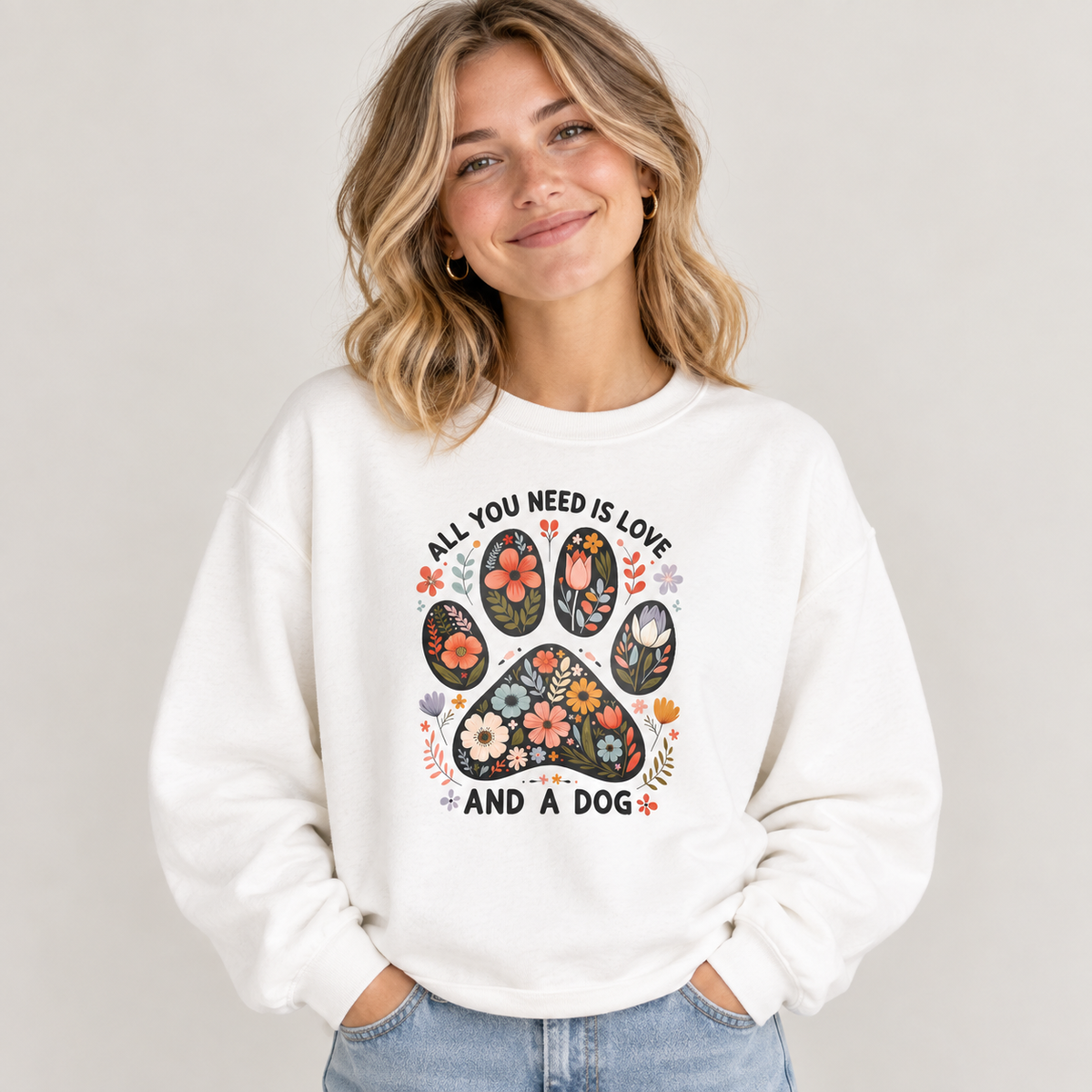 Model wearing the white All You Need Is Love And A Dog Sweatshirt with jeans