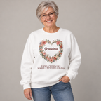 Grandmother wearing the White Personalized Grandma Sweatshirt With Grandkids Names, studio photo