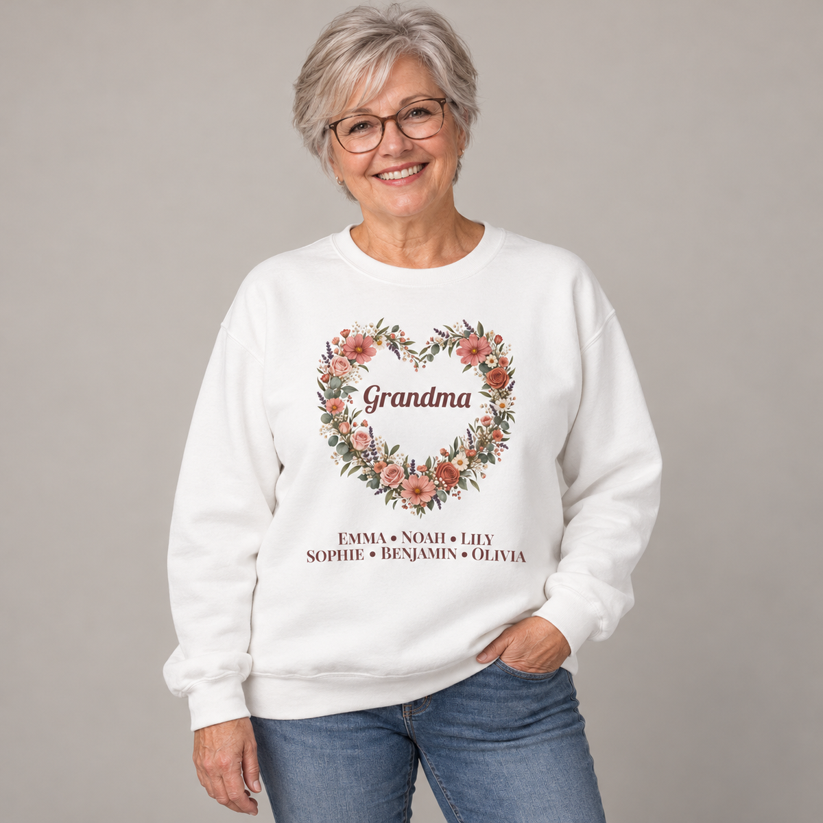 Grandmother wearing the White Personalized Grandma Sweatshirt With Grandkids Names, studio photo