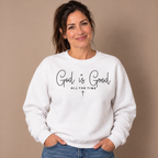Woman wearing the White God Is Good All The Time Sweatshirt, studio photo