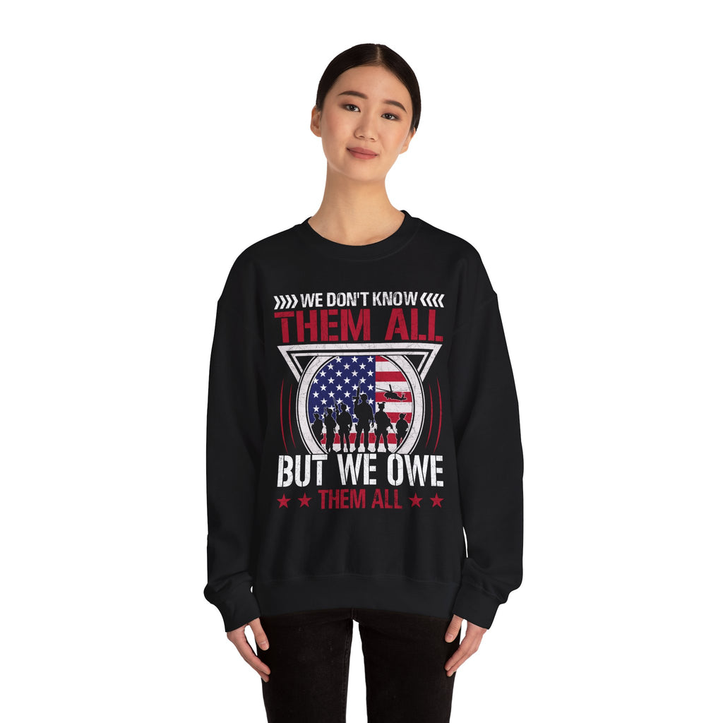 Model wearing the We Don't Know Them All But We Owe Them All Sweatshirt