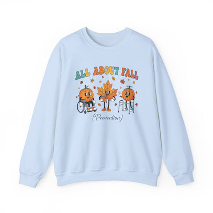 Light blue All About Fall Prevention sweatshirt with retro pumpkin and leaf characters