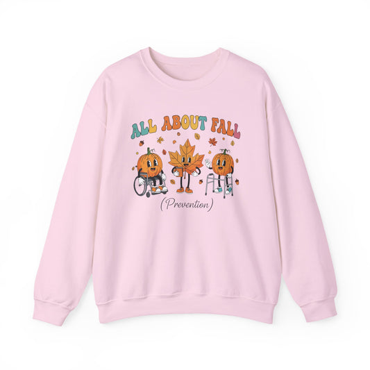 Light pink All About Fall Prevention sweatshirt with retro pumpkin and leaf characters
