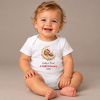 Baby wearing the White Baby's First Christmas 2026 Baby Bodysuit