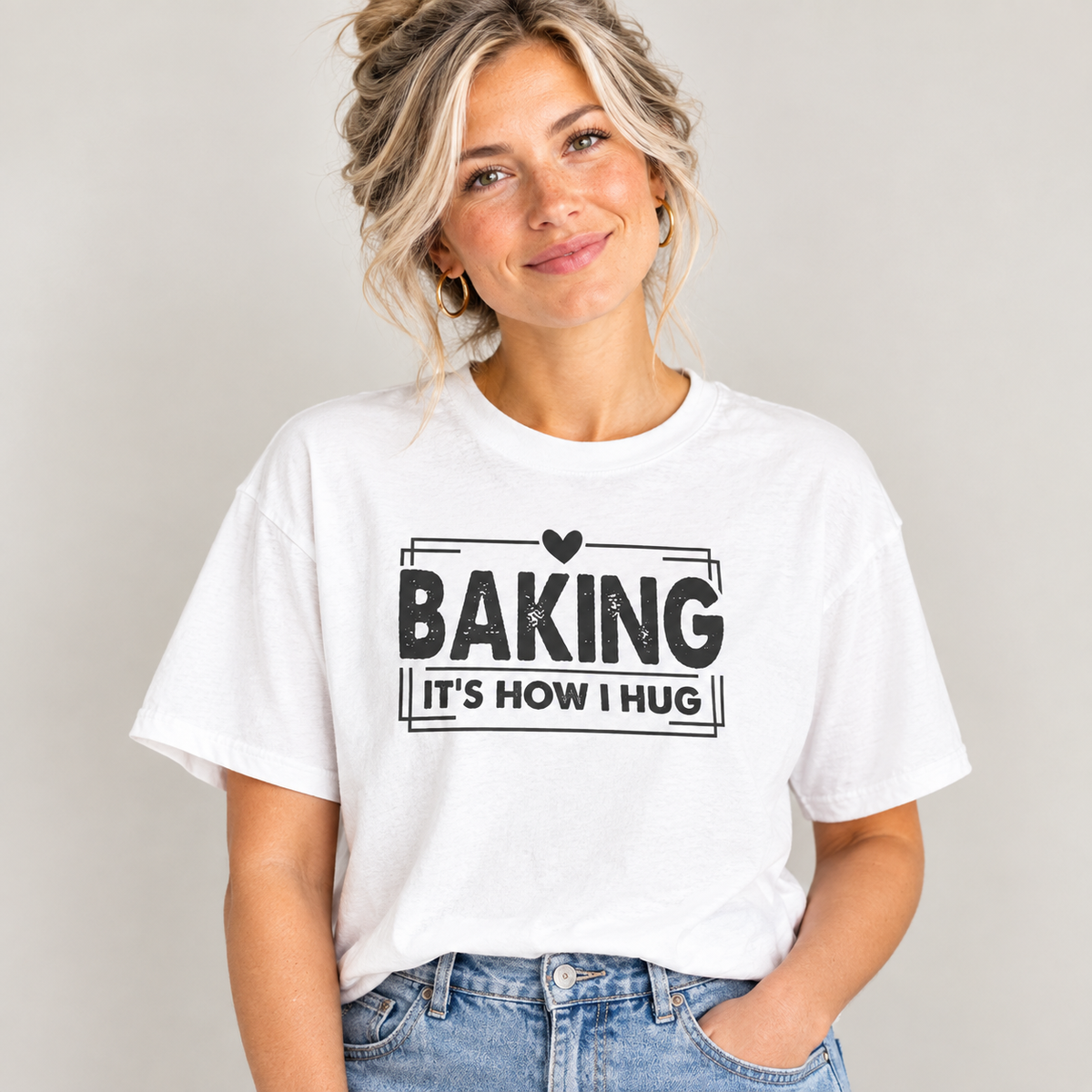 Woman wearing the white Baking It's How I Hug Black Print T-Shirt with jeans