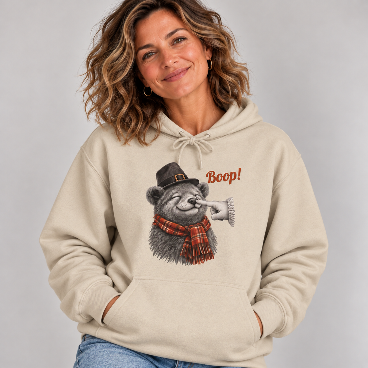 Woman wearing the Sand Bear Boop Thanksgiving Hoodie with jeans