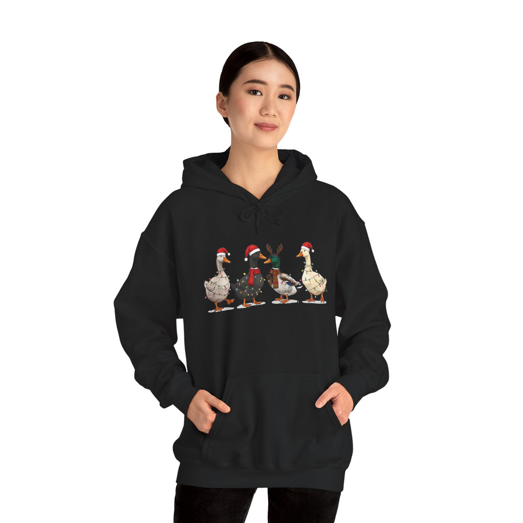 Woman wearing the Black Christmas Geese In Santa Hats Hoodie