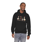 Man wearing the Black Christmas Geese In Santa Hats Hoodie, second model