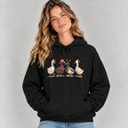 Woman wearing the Black Christmas Geese In Santa Hats Hoodie with jeans