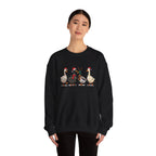 Woman wearing the Black Christmas Geese In Santa Hats Sweatshirt