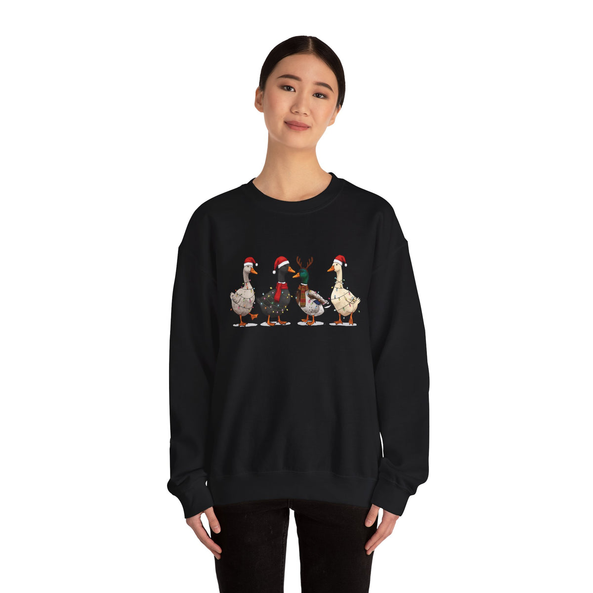 Woman wearing the Black Christmas Geese In Santa Hats Sweatshirt