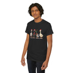 Man wearing the Black Christmas Geese In Santa Hats T-Shirt, second model