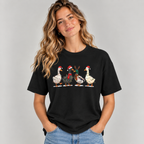 Woman wearing the Black Christmas Geese In Santa Hats T-Shirt with jeans