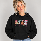 Woman wearing the Black Cookies For Two Please Christmas Hoodie with jeans