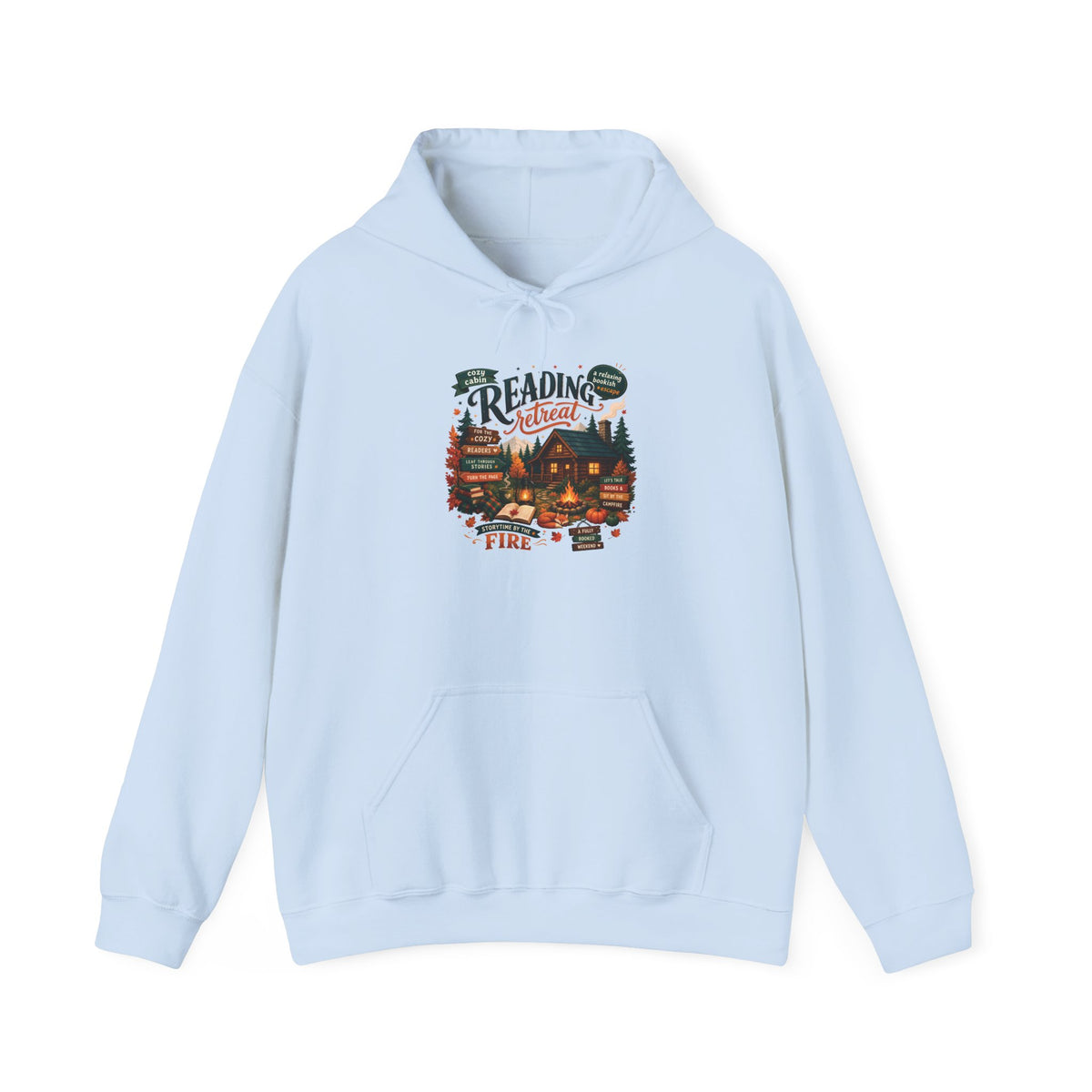 Light Blue Cozy Cabin Reading Retreat hoodie with a glowing log cabin in the pines, stacks of books and a crackling fire, front view
