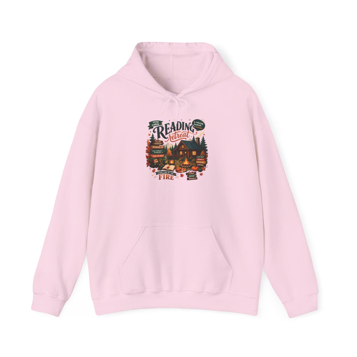 Light Pink Cozy Cabin Reading Retreat hoodie with a glowing log cabin in the pines, stacks of books and a crackling fire, front view