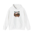 White Cozy Cabin Reading Retreat hoodie with a glowing log cabin in the pines, stacks of books and a crackling fire, front view