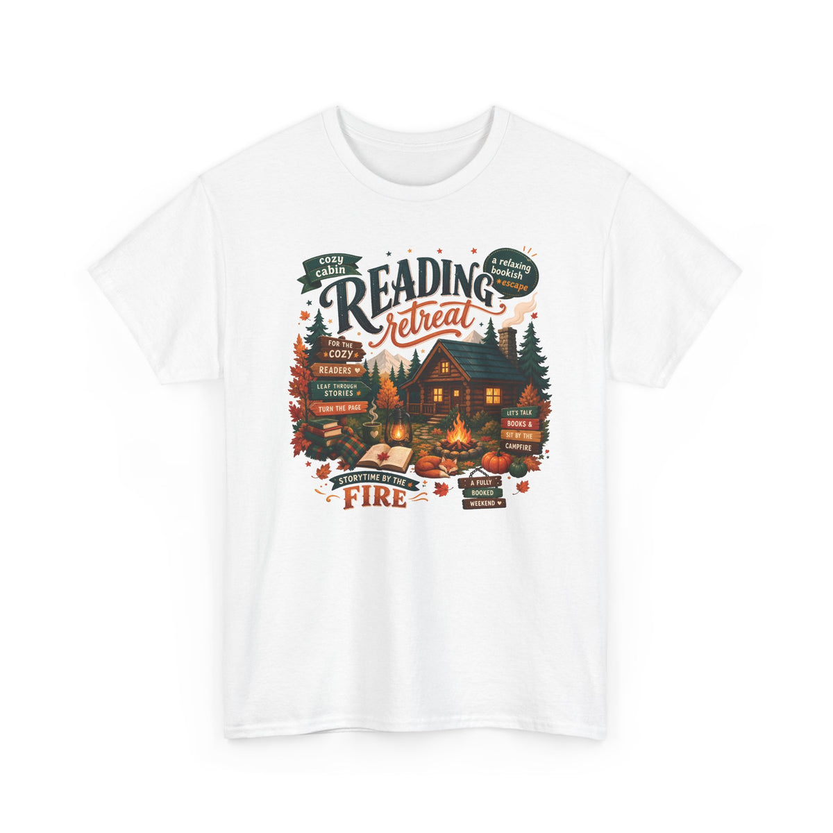 White Cozy Cabin Reading Retreat t-shirt with a glowing log cabin in the pines, stacks of books and a crackling fire, front view