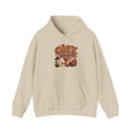 Sand Cozy Season hoodie with cable-knit lettering, hot cocoa, a candle and a plaid blanket, front view