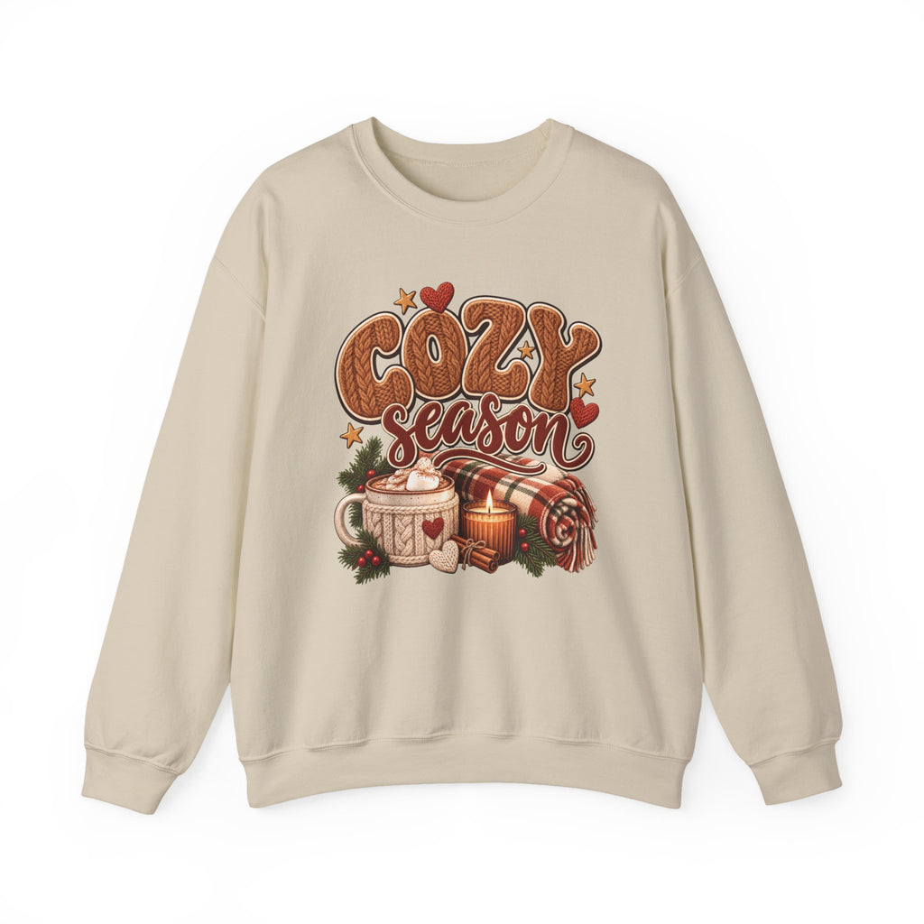 Sand Cozy Season sweatshirt with cable-knit lettering, hot cocoa, a candle and a plaid blanket, front view