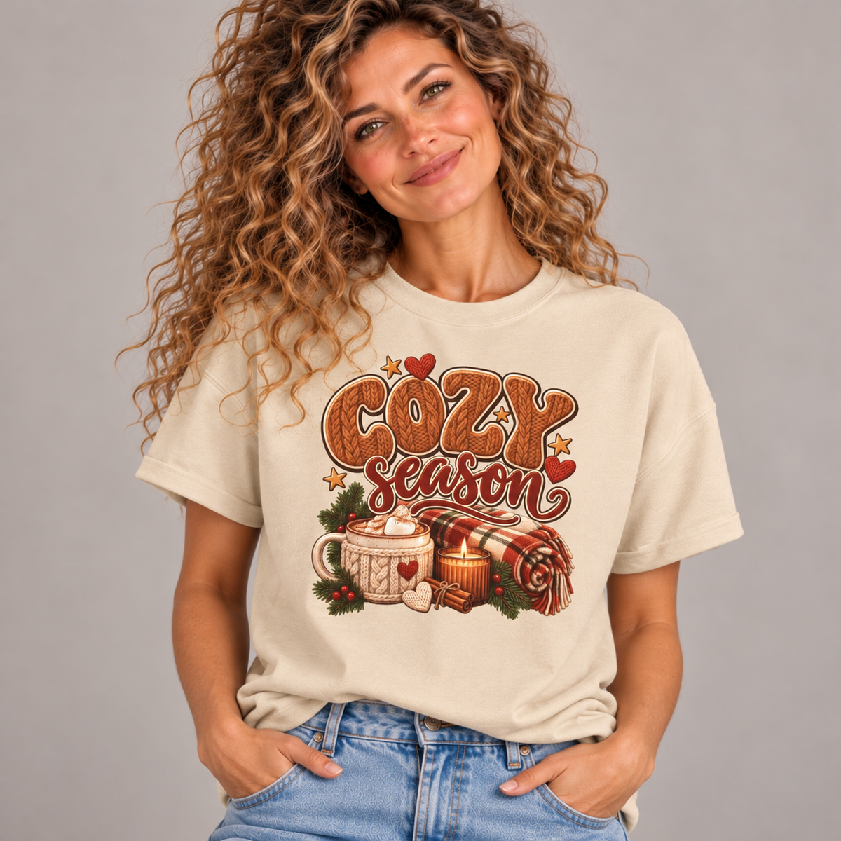 Woman wearing the Sand Cozy Season T-Shirt with jeans