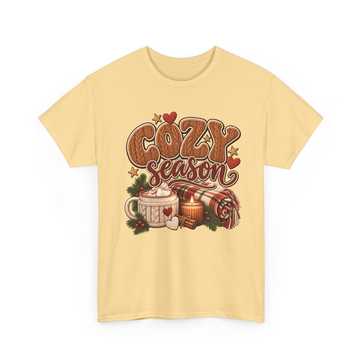 Yellow Haze Cozy Season t-shirt with cable-knit lettering, hot cocoa, a candle and a plaid blanket, front view