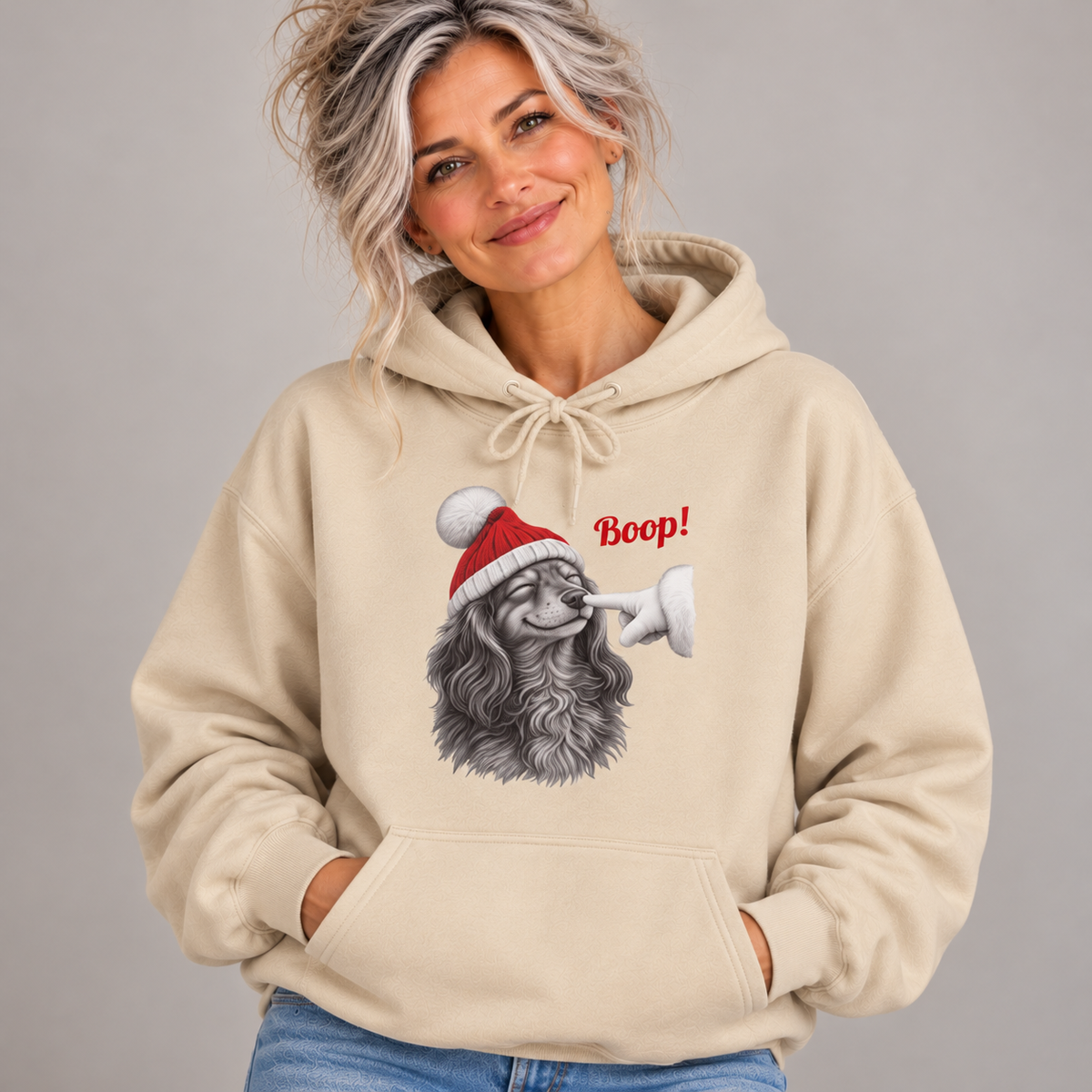 Woman wearing the Sand Dachshund Boop Christmas Hoodie with jeans