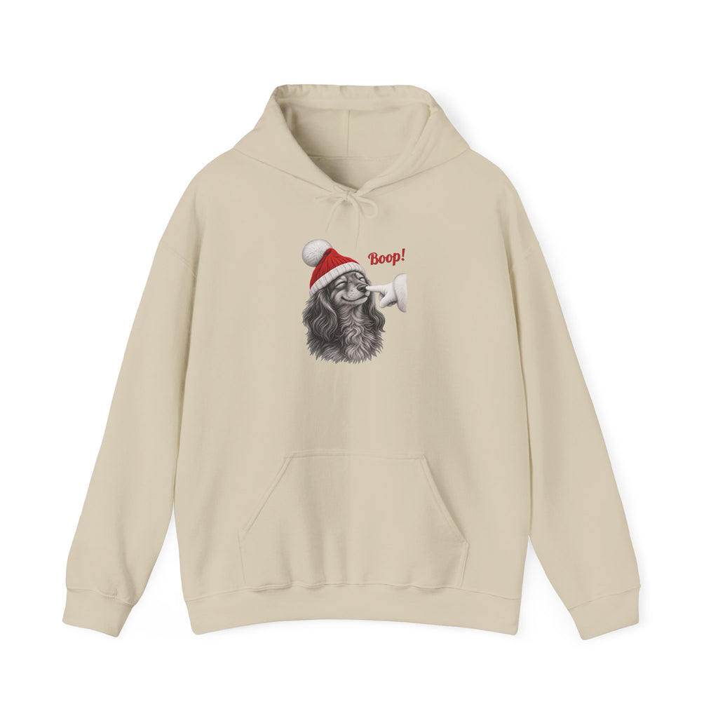 Sand Dachshund Boop Christmas hoodie with a smiling dachshund in a Santa hat getting a nose boop, front view