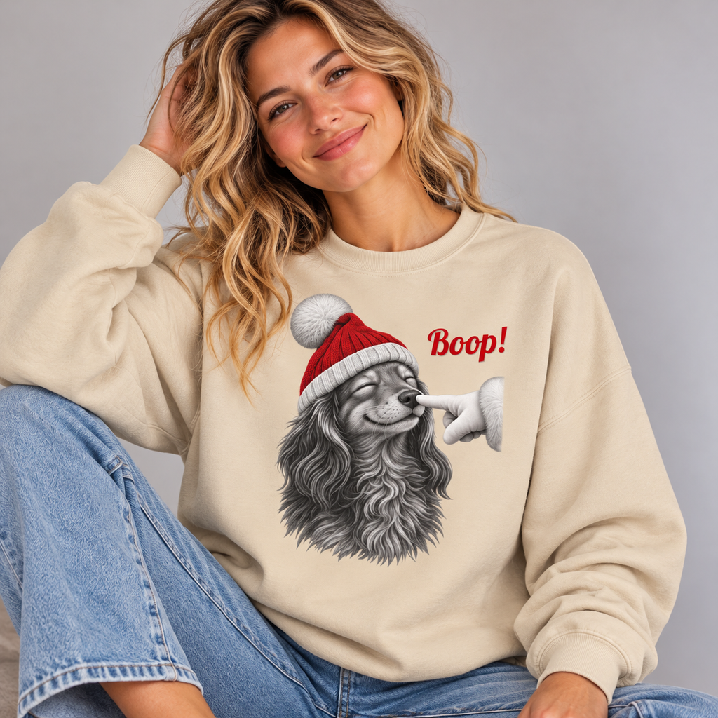 Woman wearing the Sand Dachshund Boop Christmas Sweatshirt with jeans