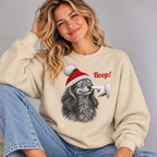 Woman wearing the Sand Dachshund Boop Christmas Sweatshirt with jeans
