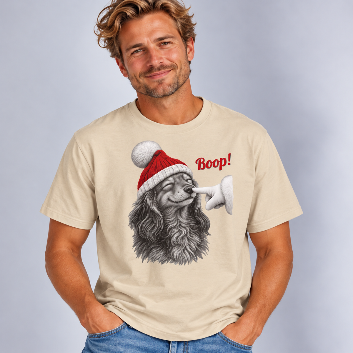 Man wearing the Sand Dachshund Boop Christmas T-Shirt with jeans