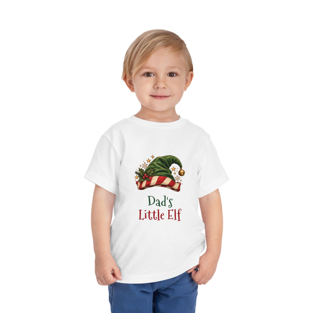 Boy wearing the Dad's Little Elf Toddler T-Shirt