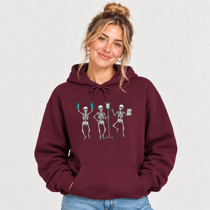Woman wearing the Dancing skeleton nurse hoodie, hands in pocket