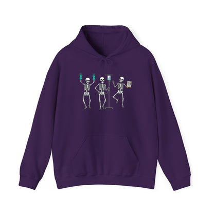 Purple Dancing skeleton nurse hoodie with three dancing skeletons in teal gloves, front view