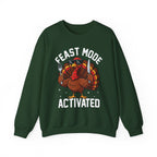 Forest Green Feast Mode Activated sweatshirt with a hungry cartoon turkey holding a fork and knife, front view