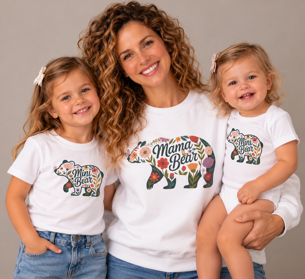 Mom and two daughters wearing matching Floral Mama Bear sweatshirt and Mini Bear t-shirt and baby bodysuit