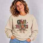 Woman wearing the Sand Give Thanks Sweatshirt with jeans