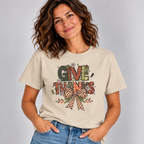 Woman wearing the Sand Give Thanks T-Shirt with jeans