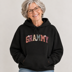 Woman wearing the Grammy retro daisy varsity hoodie
