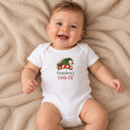 Baby wearing the White Grandma's Little Elf Baby Bodysuit