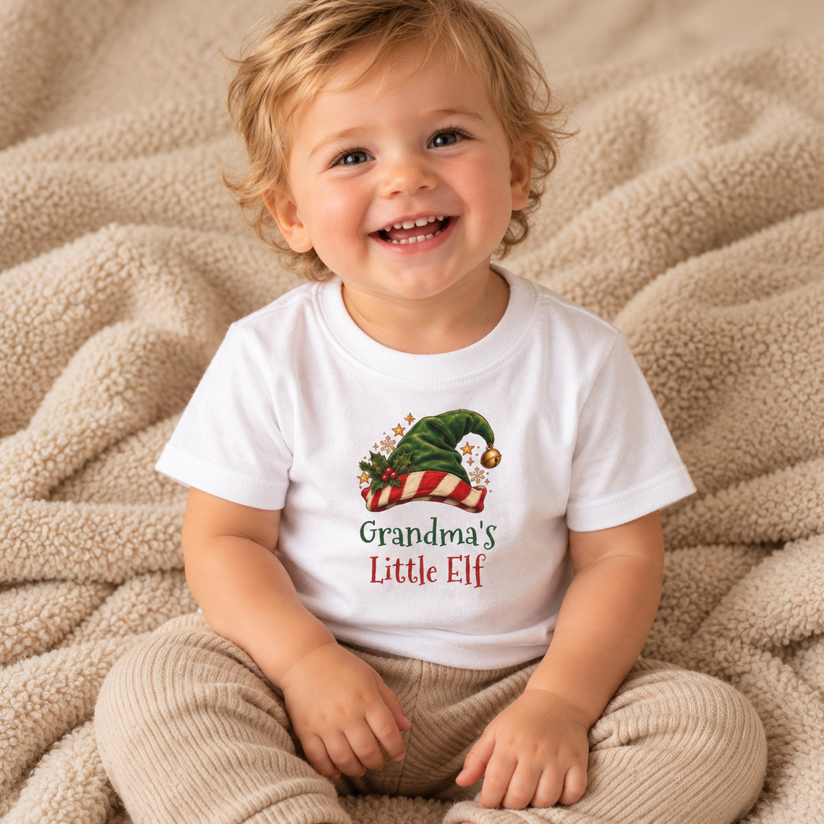 Baby wearing the White Grandma's Little Elf Baby T-Shirt