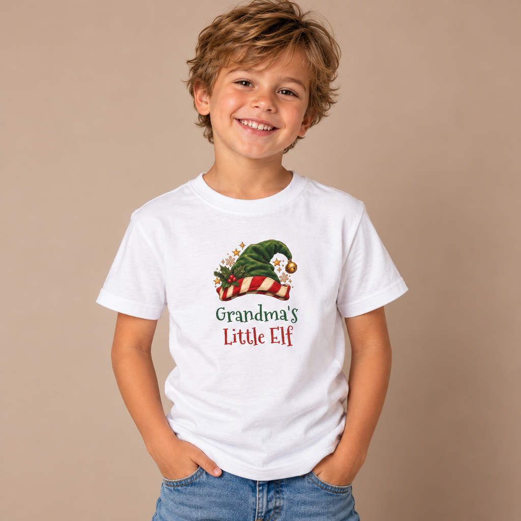Boy wearing the White Grandma's Little Elf Kids T-Shirt