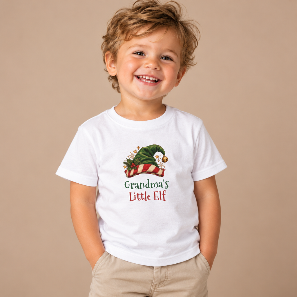Boy wearing the White Grandma's Little Elf Toddler T-Shirt