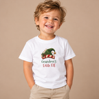 Boy wearing the White Grandma's Little Elf Toddler T-Shirt