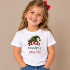 Girl wearing the White Grandpa's Little Elf Kids T-Shirt