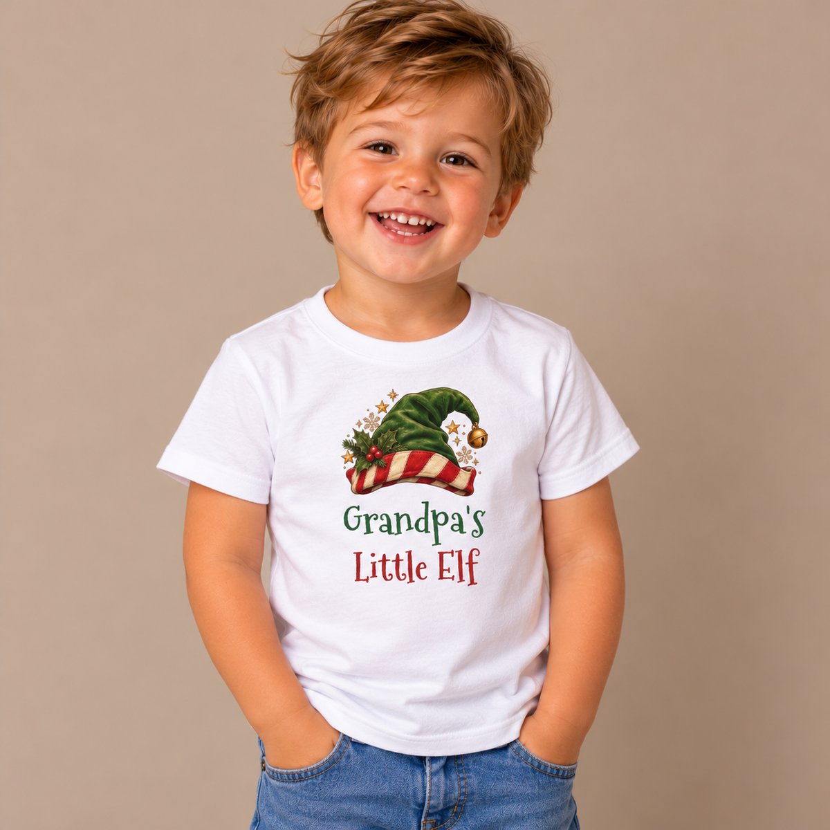 Boy wearing the White Grandpa's Little Elf Toddler T-Shirt