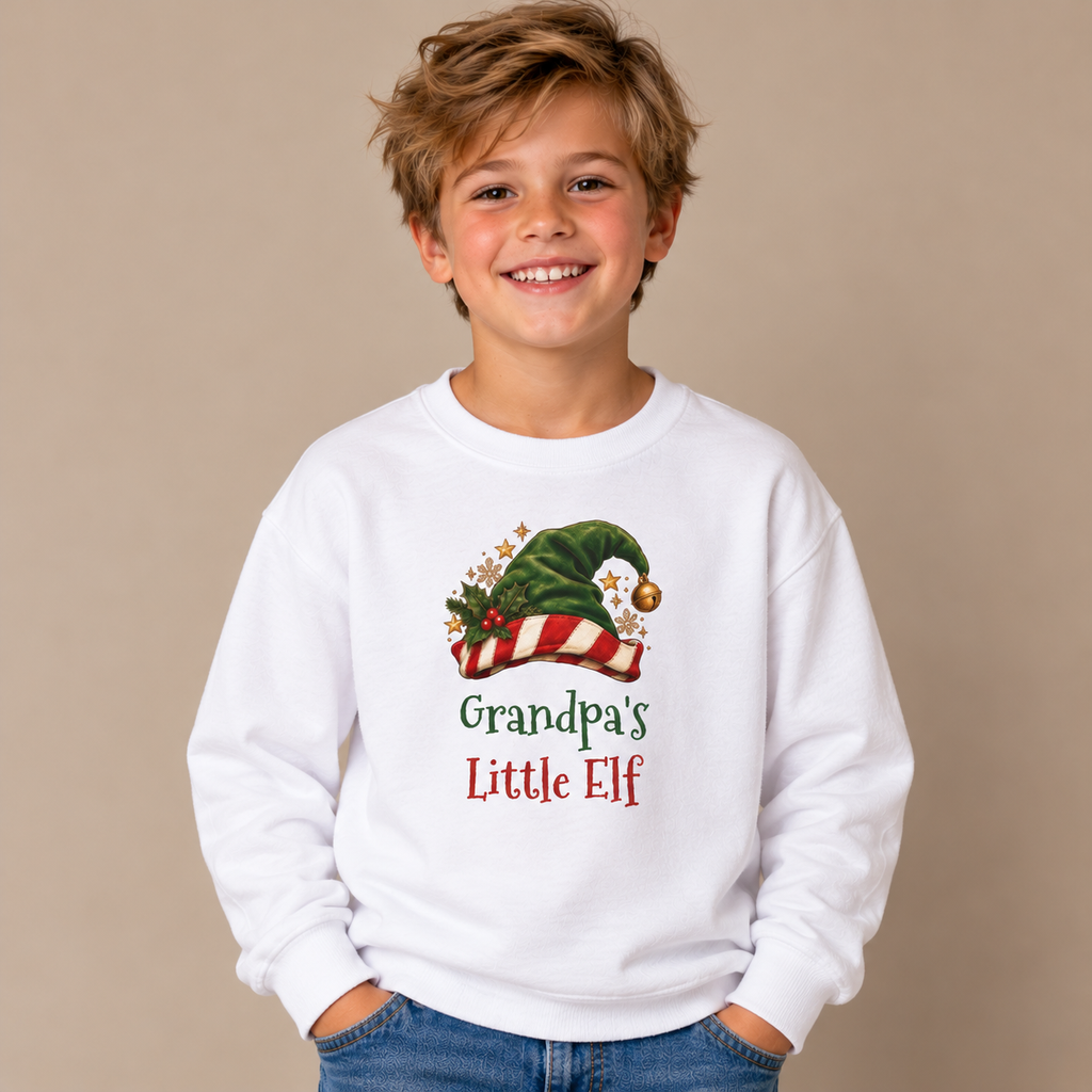 Boy wearing the White Grandpa's Little Elf Youth Sweatshirt
